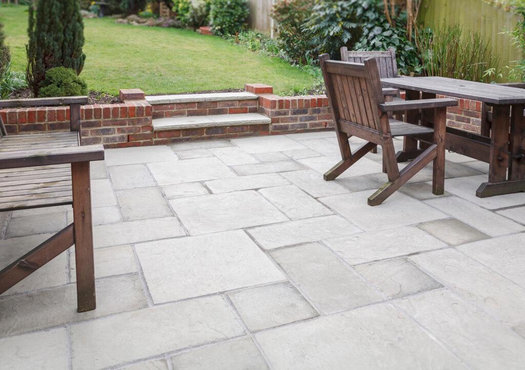 Patio integrated with a retaining wall