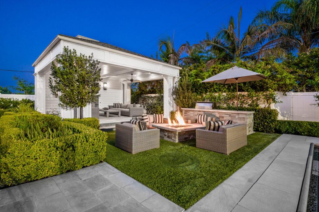 A backyard with a fire pit in a new construction home in Encino, California